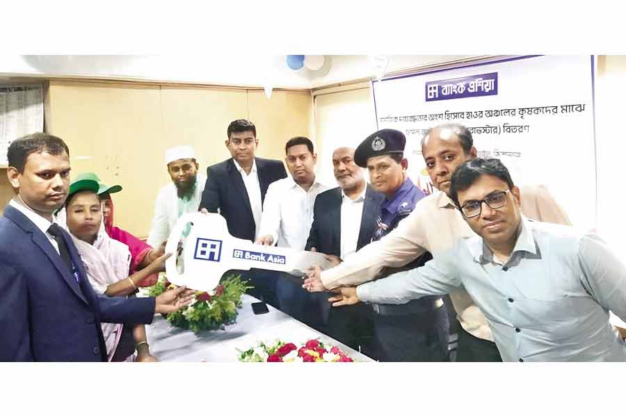 Bank Asia distributes harvesting machines among haor farmers The